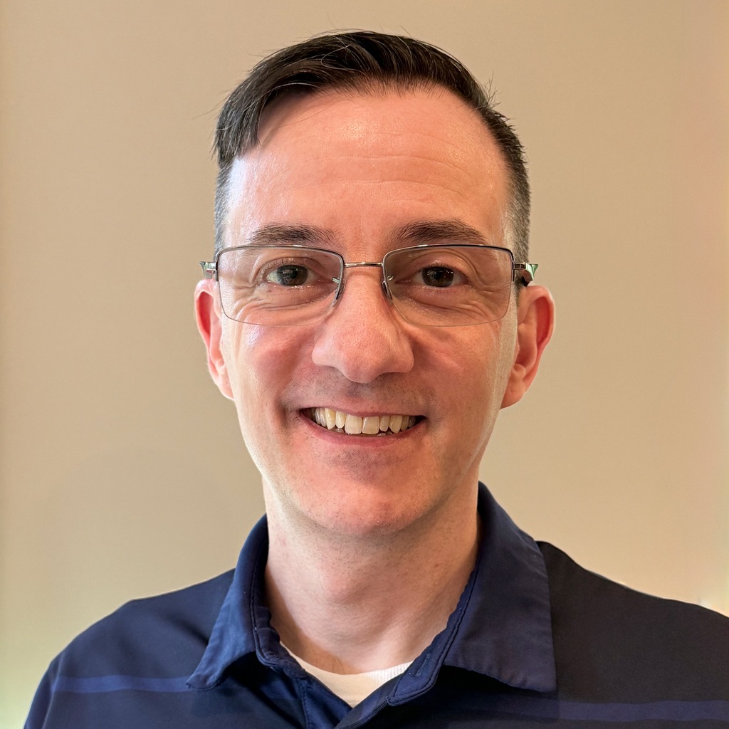 Headshot of agency owner Mike Passarella-George