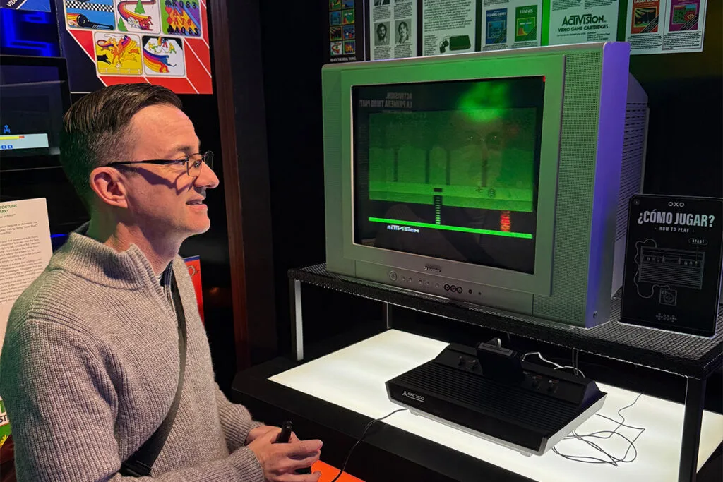 Parent playing Atari video game